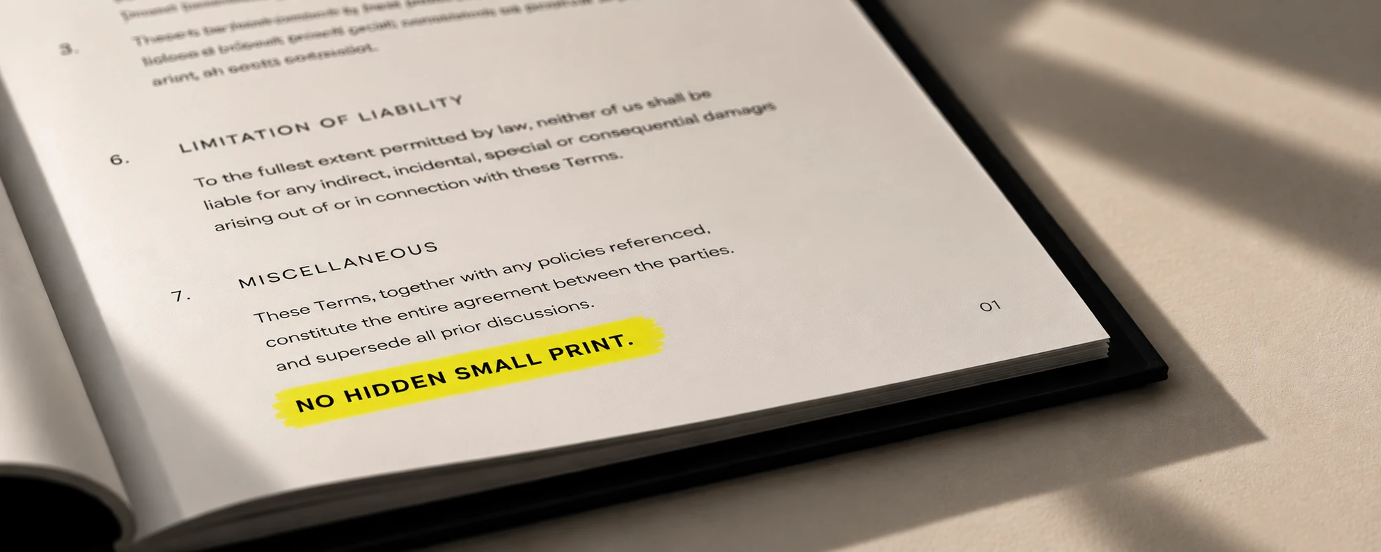 An open document with the words “NO HIDDEN SMALL PRINT.” highlighted in yellow.